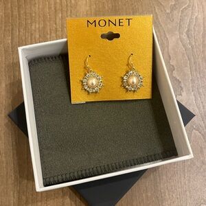 Costume earrings featuring a floral design with pearl center